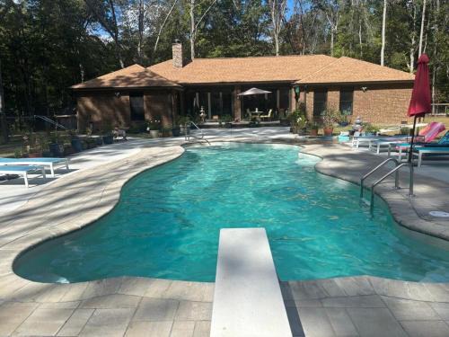Tullahoma Villa | Quiet Forest Vacation home on a Private Road with Spacious Patios, Fire pit, Pet friendly and a Private pool