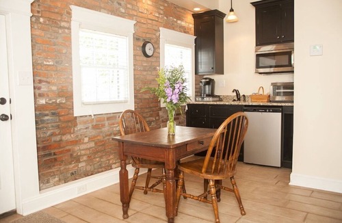 St. Charles Cottage | 1830's Luxury Brick Cottage, Cozy Fireplace, right off the Cobblestone Streets!
