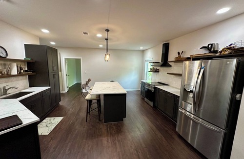 Fairburn Apartment | Backyard event space with basement apartment with kitchen, fitness room.
