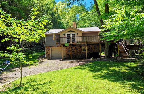 Dayton Cabin | Beautiful 2 BR cabin with a wall of windows overlooking the deck and stream.