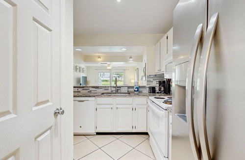 Butler Beach Condo | Garden-level condo with patio, 2 pools, gym, tennis & sauna - steps to the beach
