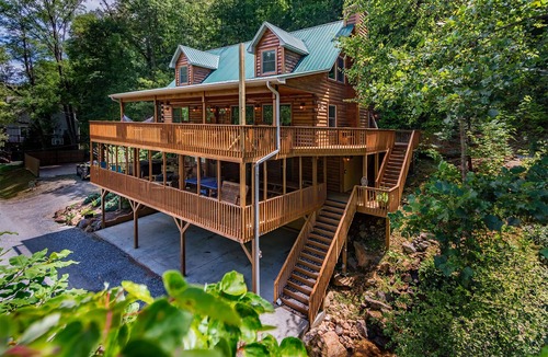Sylva Cabin | Log cabin with large decks on the Bank of the Tuckasegee River.