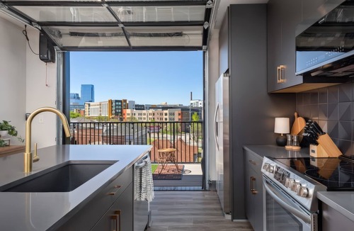 Rolling Mill Hill Apartment | Nashville getaway: 2 downtown homes, rooftop deck, sleeps 14 near Broadway