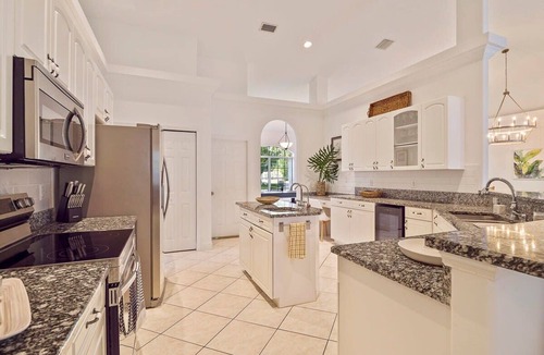 Palm Coast House | Oasis Heated Pool Spa Fenced Yard Bicycles