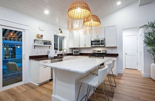 St. Augustine Beach House | Recently Remastered Beachside Boat House STEPS from the Ocean with HEATED pool.