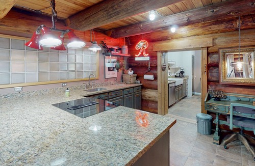 Carnation House | Unique mountain view log home with a wood stove, balcony, patio, & board games