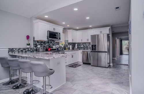 McHenry House | Waterfront Vacation Rental on Fox River | Walk to Downtown McHenry | 3BR/2BA Home with Private Pier