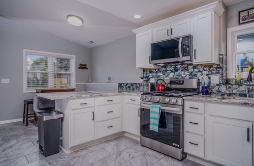 McHenry House | Waterfront Vacation Rental on Fox River | Walk to Downtown McHenry | 3BR/2BA Home with Private Pier