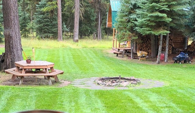 Authentic Log Cabin + Bunkhouse and Hot Tub in Seeley Lake - Sleeps 12 in Seeley Lake