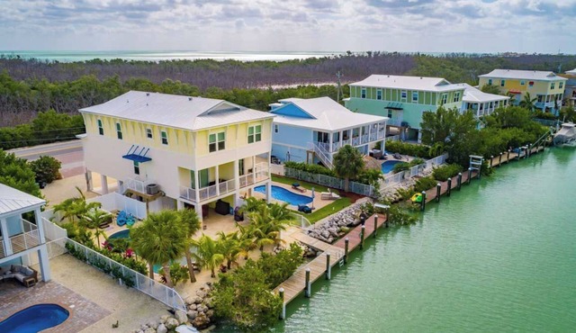 Canal Front with Large Custom Pool, Lush Landscaping, Hot Tub, 30' Dock, Kayaks!