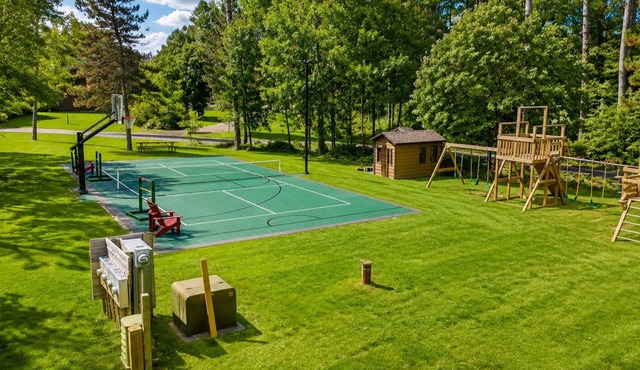 Lakeview Home with Dock on the Whitefish Chain, Outdoor Pool, Pickleball & More