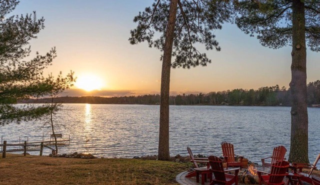 Pristine home with sandy beach, firepit, dock and pontoon. ATV trails nearby.
