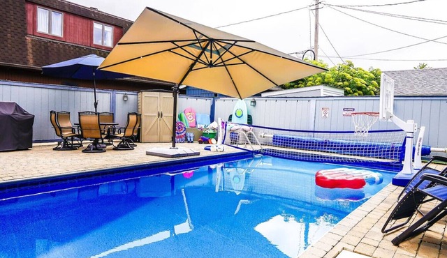 Private heated pool in back & Sandy beach in front in Huron