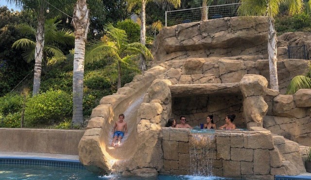 Spacious 6 Bedroom Vacation Home with Waterslide & Heated Saltwater Pool