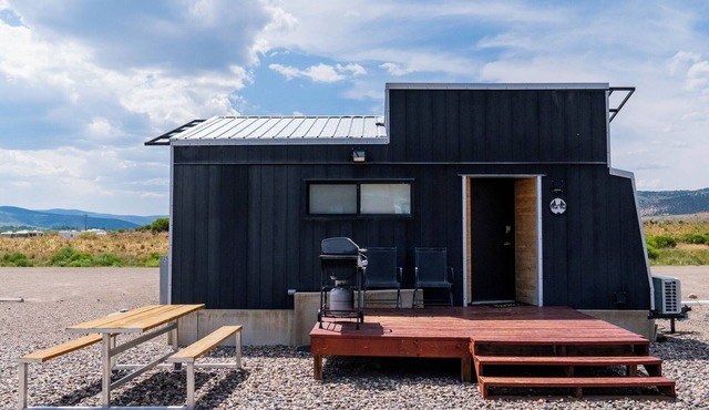 This Tiny Home is custom made by a Colorado craftsman has one Queen bed in loft accessible by stairs and also has a fold out Full futon on main level. Sleeps up to 4. Please note, this home does have a sleeping area in a loft. If you require an accom in Meeker