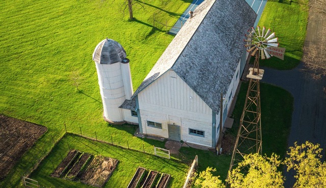 Unity Farm: Three private cottages set across restored prairie and forest along the St. Croix River, with a barn and tennis courts.