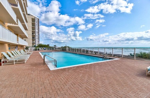 Daytona Beach Shores Apartment | Elegant Oceanfront Pool Hot Tub at Sanibel Condos