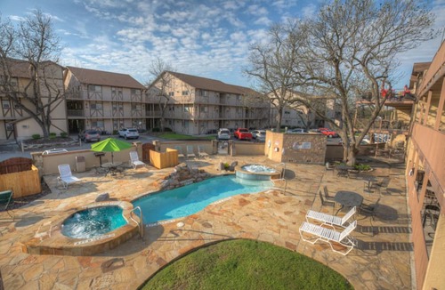 New Braunfels Condo | Waterwheel on the Guadalupe - river access, 2 pools, 4 hot tubs, 5 acres of lawn